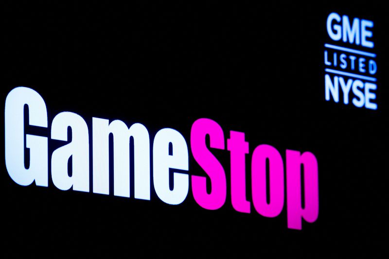 FILE PHOTO: A screen displays the logo and trading information for GameStop on the floor of the New York Stock Exchange (NYSE) in New York City, U.S., March 29, 2022.  REUTERS/Brendan McDermid/File Photo