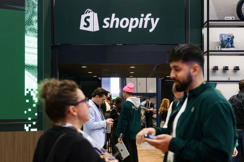 People talk at the exhibit for Shopify at National Retail Federation (NRF) 2026: Retail's Big Show, in New York City, U.S., January 12, 2026. REUTERS/Kylie Cooper