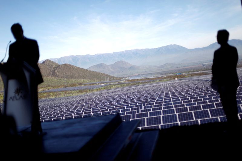 FILE PHOTO: Atlas Renewable Energy's Chile General Manager Alfredo Solar (L) delivers a speech during the opening ceremony of Quilapilun solar plant on the outskirts of Santiago, Chile, July 19, 2017. REUTERS/Ivan Alvarado/File Photo