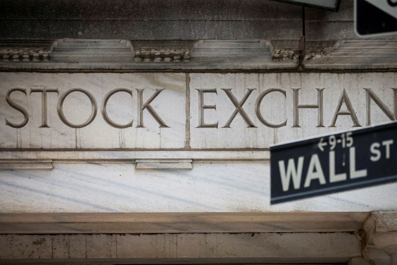 FILE PHOTO: The Wall Street entrance to the New York Stock Exchange (NYSE) is seen in New York City, U.S., November 15, 2022. REUTERS/Brendan McDermid/File Photo
