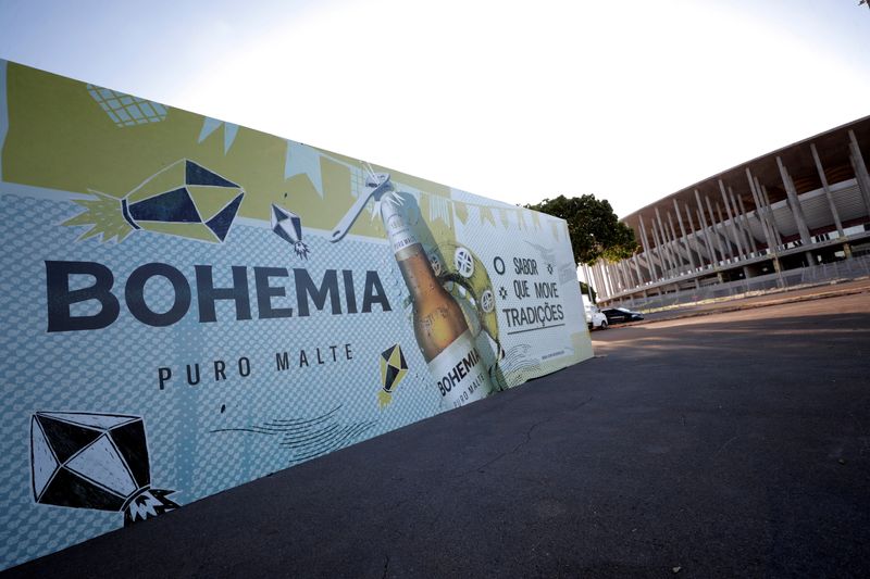 FILE PHOTO: A booth of Bohemia beer produced by Brazil-based Ambev, is mounted in front of the stadium of the Mane Garrincha National Stadium in Brasilia, Brazil June 9, 2021. REUTERS/Ueslei Marcelino/File Photo