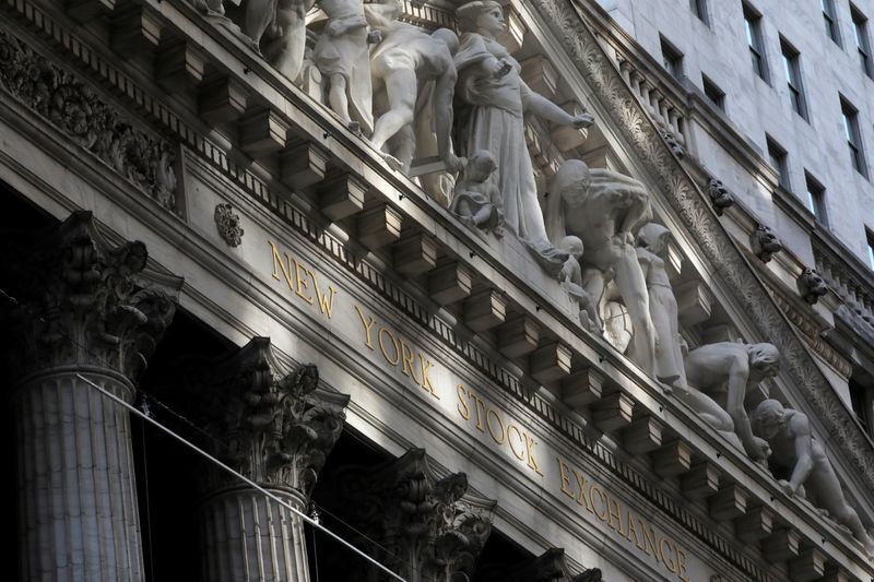 Morning sunlight falls on the facade of the New York Stock Exchange (NYSE) building after the start of Thursday's trading session in Manhattan in New York City, New York, U.S., January 28, 2021. REUTERS/Mike Segar