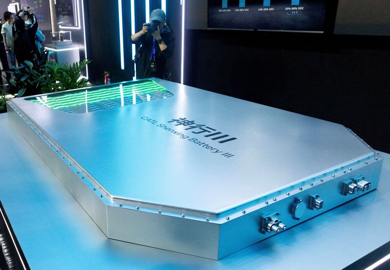FILE PHOTO: FILE PHOTO: A photographer takes pictures of an installation featuring CATL Shenxing Battery III during company’s Tech Day event ahead of the Auto China show, in Beijing, China, April 21, 2026. REUTERS/Maxim Shemetov/File Photo