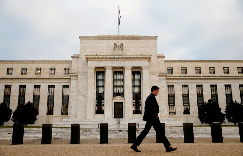 FILE PHOTO: A man walks past the Federal Reserve Bank in Washington, D.C., U.S. December 16, 2015.   REUTERS/Kevin Lamarque/File Photo            GLOBAL BUSINESS WEEK AHEAD PACKAGE Ð SEARCH BUSINESS WEEK AHEAD MARCH 13 FOR ALL IMAGES