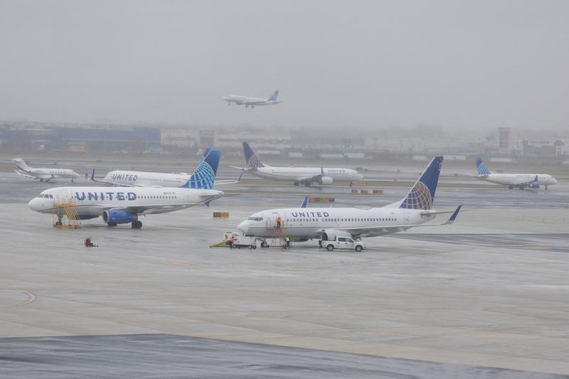 FILE PHOTO: United Airlines planes parked at tarmac, Newark Liberty International Airport in Newark, New Jersey,  U.S., March 23, 2026. Picture taken through the glass. REUTERS/Jeenah Moon/File Photo