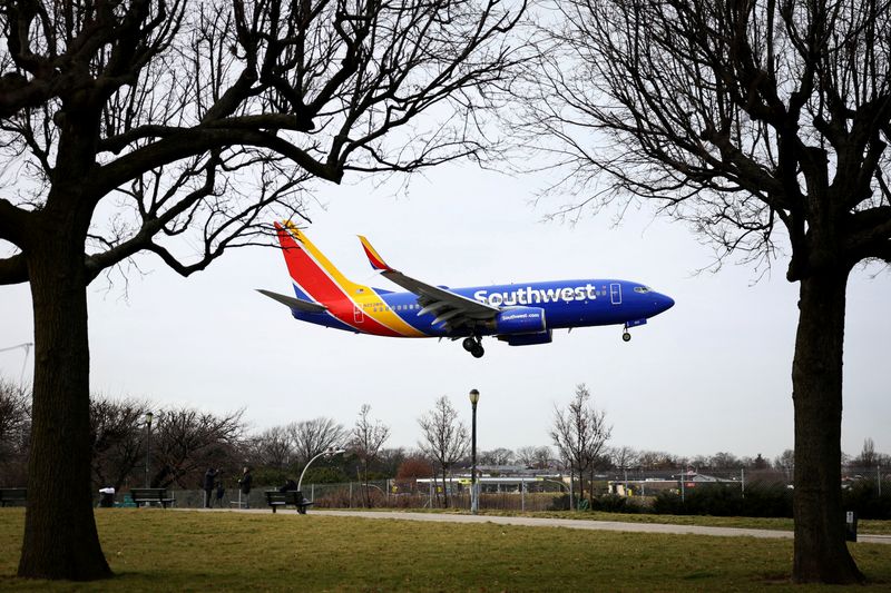 FILE PHOTO: A Southwest Airlines jet comes in for a landing at LaGuardia Airport in New York City, New York, U.S., January 11, 2023. REUTERS/Mike Segar/File Photo