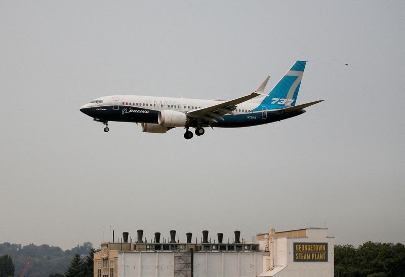 FILE PHOTO: A Boeing 737 MAX 7 aircraft lands at Boeing Field in Seattle, Washington, U.S. September 30, 2020. REUTERS/Lindsey Wasson//File Photo