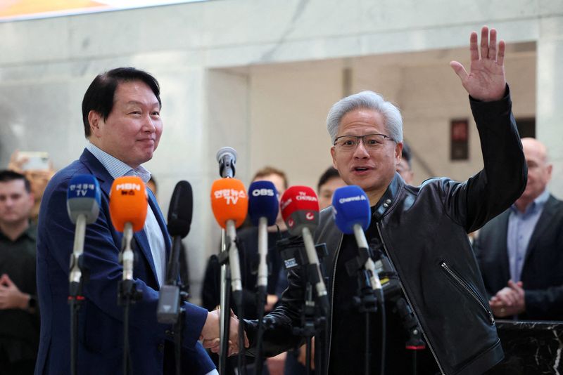 Nvidia CEO Jensen Huang shakes hands with SK Group Chairman Chey Tae-won after a media briefing following their meeting at SK group’s office building in Seoul, South Korea, June 8, 2026. REUTERS/Kim Hong-Ji