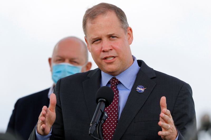 FILE PHOTO: NASA Administrator Jim Bridenstine speaks at a pre-launch news conference as a SpaceX Falcon 9 rocket is readied to carry four astronauts on the first operational NASA commercial crew mission at Kennedy Space Center in Cape Canaveral, Florida, U.S., November 13, 2020. REUTERS/Joe Skipper/File Photo