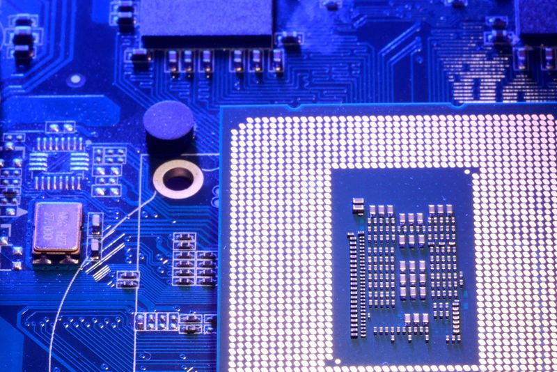 FILE PHOTO: Computer motherboard and chip appear in this illustration taken August 25, 2025. REUTERS/Dado Ruvic/Illustration/File Photo
