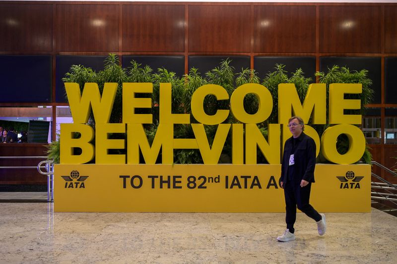 A man walks in front of a welcome message during the International Air Transport Association (IATA) Annual General Meeting in Rio de Janeiro, Brazil, June 7, 2026. REUTERS/Tita Barros.