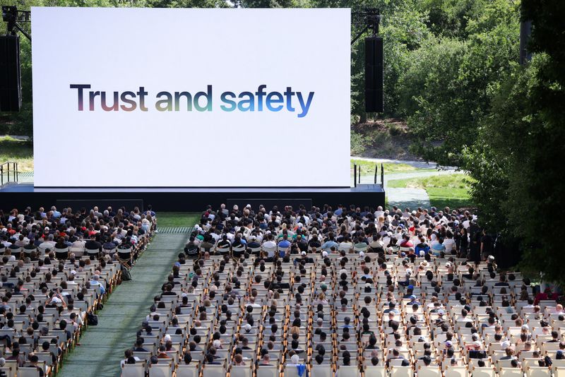 Attendees watch a presentation during Apple's annual Worldwide Developers Conference in Cupertino, California, U.S., June 8, 2026. REUTERS/Carlos Barria