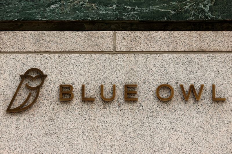 A logo for Blue Owl Capital is displayed on a midtown Manhattan office building in New York City, U.S., February 24, 2026.  REUTERS/Brendan McDermid