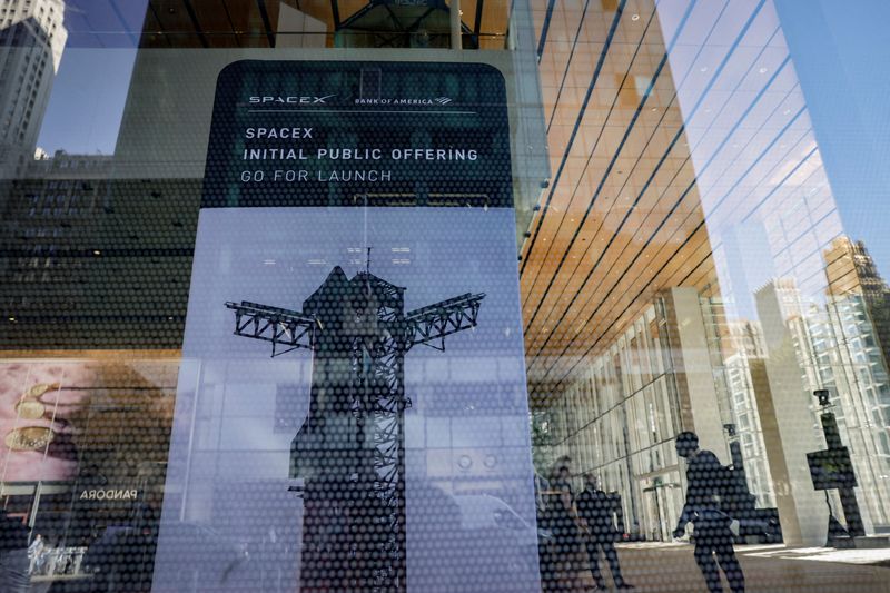 SpaceX initial public offering signage is displayed at the Bank of America building in New York, U.S., June 4, 2026. REUTERS/Jeenah Moon