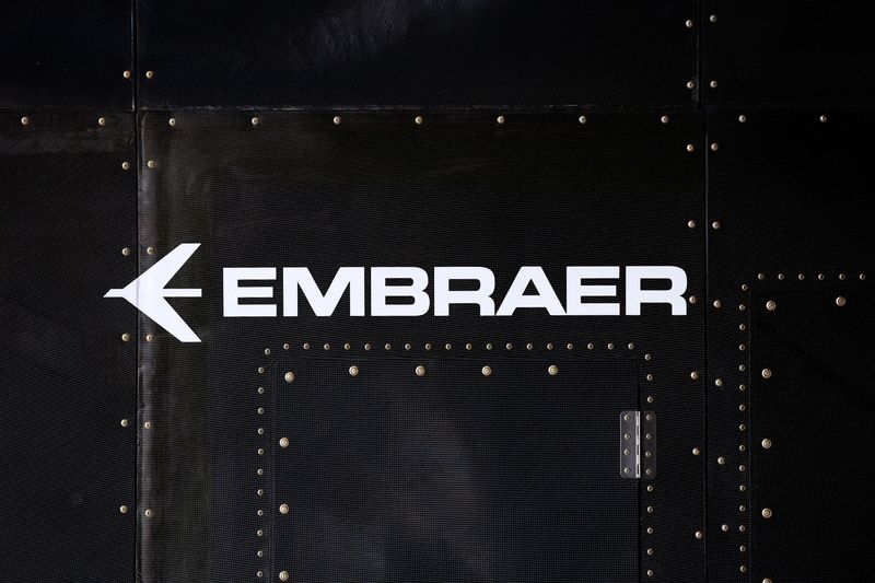 The Embraer logo is seen at the full-scale prototype of an electric vertical take-off and landing (eVTOL) aircraft developed by Eve Air Mobility, an Embraer group company, as it is presented for the first time in Gaviao Peixoto, Brazil July 3, 2024. REUTERS/Amanda Perobelli