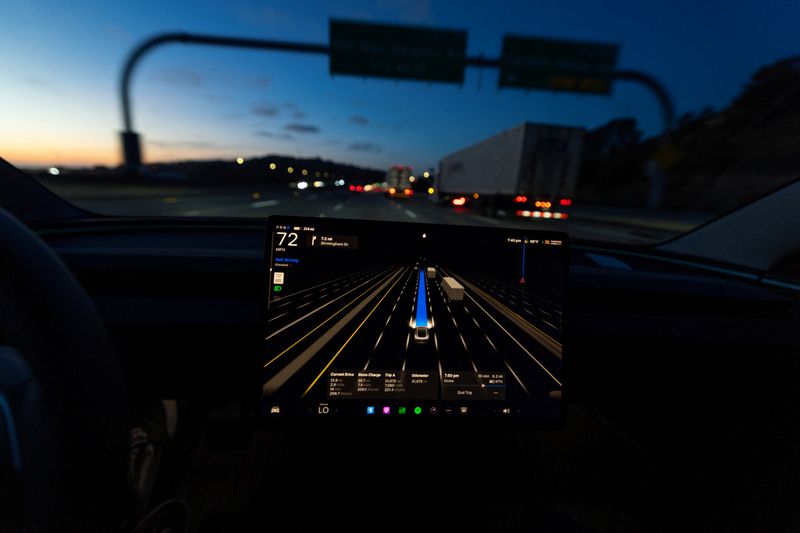 A display of a Tesla Model 3 using Full Self-Driving Supervised on a highway in San Diego, California, U.S., April 15, 2026. REUTERS/Mike Blake