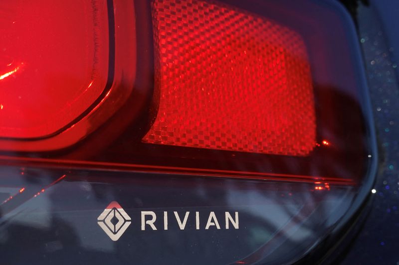 The Rivian name and logo are shown on one of their new electric SUV vehicles in San Diego, U.S., December 16, 2022. REUTERS/Mike Blake