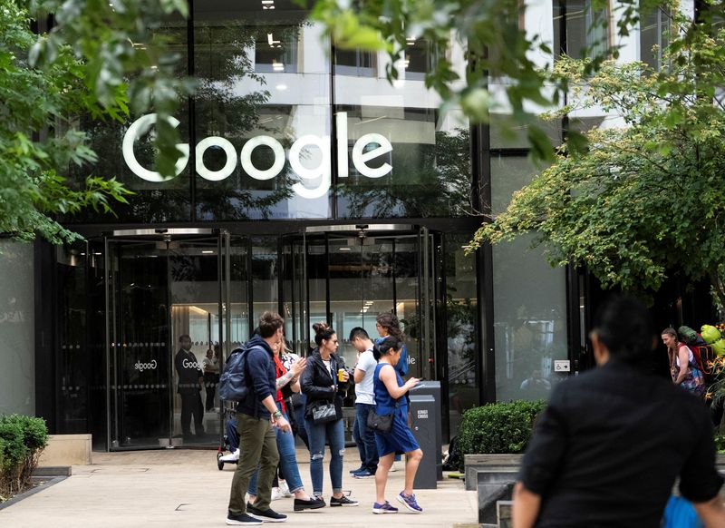 FILE PHOTO: People stand outside the Google offices in London, Britain, June 24, 2025. REUTERS/Carlos Jasso/File Photo