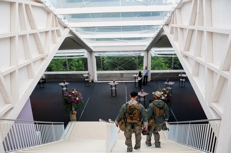 Secret Service police members walk down the stairs at Buergenstock Resort Lake Lucerne on the day of talks between the U.S., Iran, Pakistan, and Qatar at the Lake Lucerne Summit, aimed at advancing a deal to end the Middle East conflict, near Stansstad, Switzerland, June 21, 2026. REUTERS/Nathan Howard/Pool