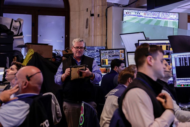 Traders work on the floor at the New York Stock Exchange (NYSE) in New York City, U.S., June 18, 2026. REUTERS/Jeenah Moon