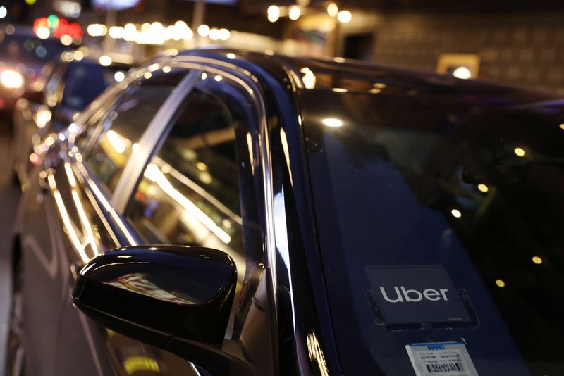The logo for Uber Technologies is seen on a vehicle in Manhattan, New York City, New York, U.S., November 17, 2021. REUTERS/Andrew Kelly