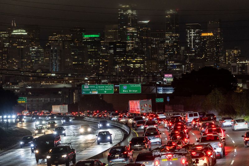 Car traffic is seen during rush hour in downtown San Francisco, California, U.S., July 29, 2025. REUTERS/Carlos Barria