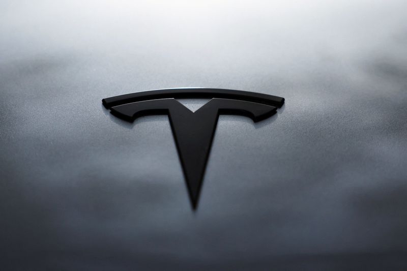 FILE PHOTO: The logo of Tesla is seen on a Tesla Model Y during Tesla Inc.'s official launch in Bogota, Colombia, November 20, 2025. REUTERS/Luisa Gonzalez/File Photo