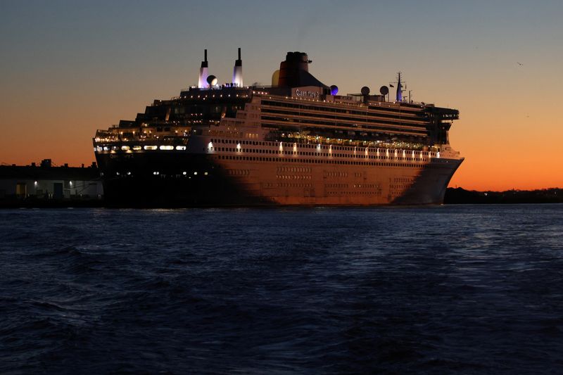 FILE PHOTO: The Queen Mary 2 cruise ship by Cunard Line, owned by Carnival Corporation is seen docked at Brooklyn Cruise Terminal in Brooklyn, New York City, U.S., December 20, 2021. REUTERS/Andrew Kelly/File Photo
