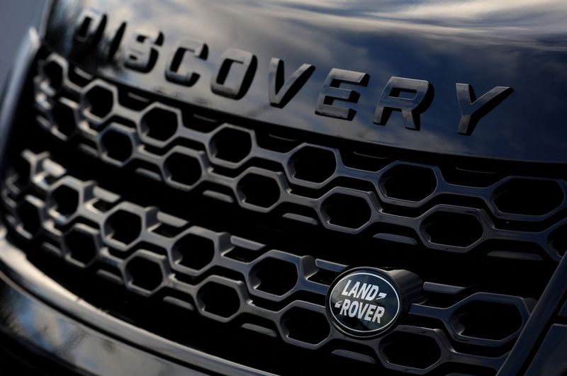 FILE PHOTO: A company logo is seen on the front of a newly finished Land Rover Discovery Sport outside Jaguar Land Rover’s Halewood factory in Liverpool, Britain, December 6, 2022. REUTERS/Phil Noble/File Photo