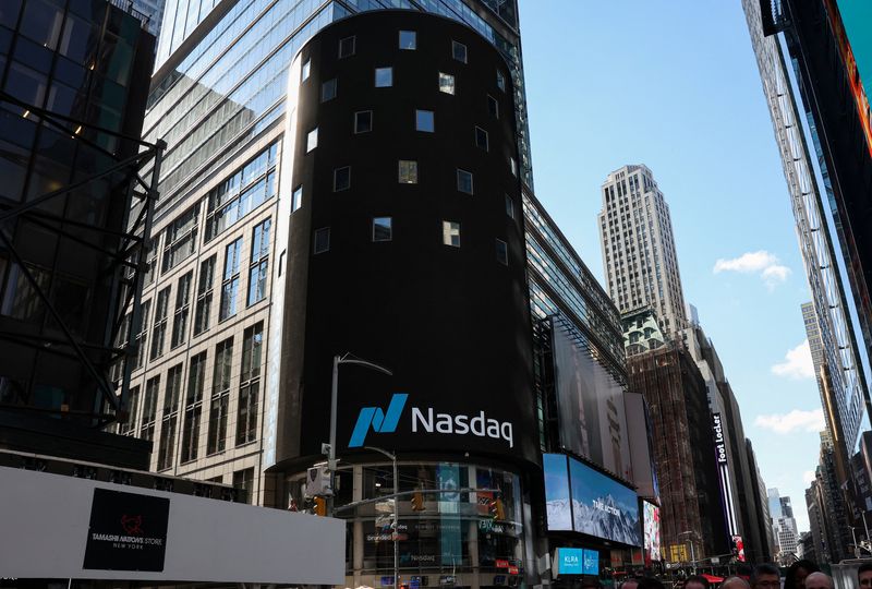 The Nasdaq logo is displayed on a screen at the Nasdaq Market site in Times Square in New York City, U.S., April 17, 2026. REUTERS/Brendan McDermid