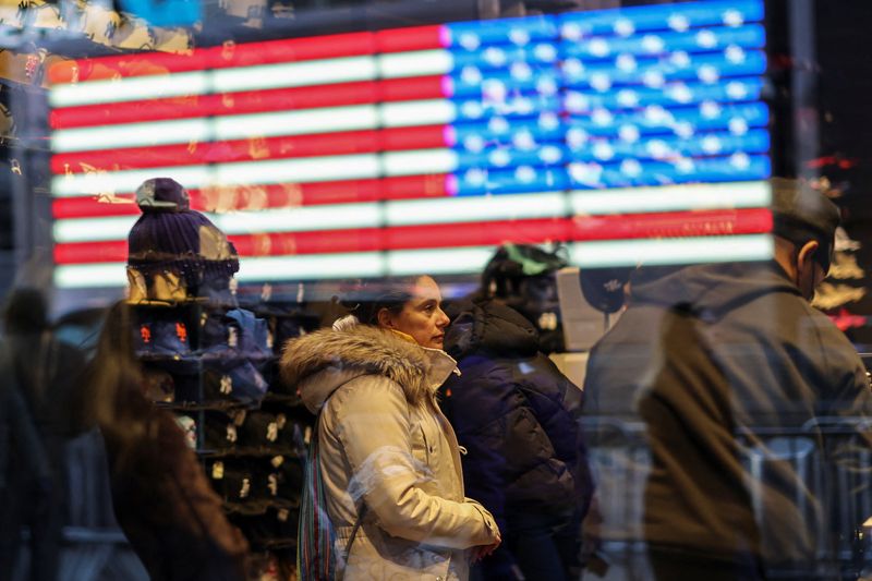 Tourists shop inside a store in Times Square, in New York City, U.S., December 30, 2025. REUTERS/Tyrone Siu