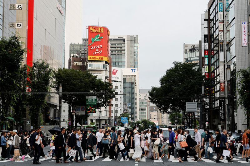 FILE PHOTO: People walk at a shopping district in Tokyo, Japan, June 16, 2026. REUTERS/Kim Kyung-Hoon/File Photo