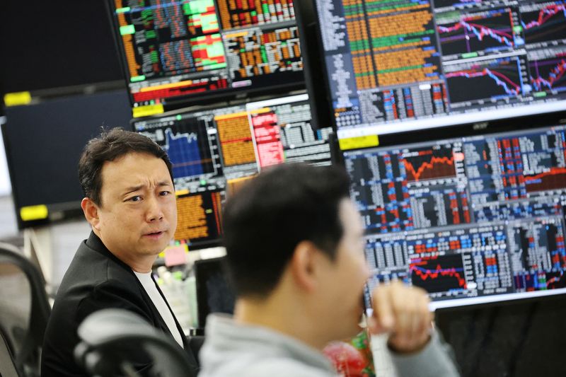 Namkoong Taehun, team manager of S&T Division and FX Platform Business Dept, works a late-night shift in preparation for the launch of South Korea's 24-hour won-dollar trading market from July 6, at Hana Bank's dealing room in Seoul, South Korea, June 16, 2026. REUTERS/Kim Hong-Ji