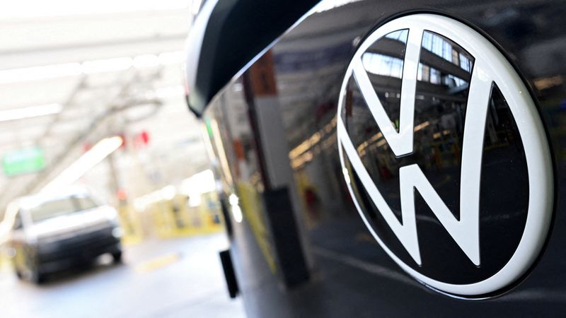 FILE PHOTO: The Volkswagen logo is displayed on a vehicle during a media tour at Volkswagen Commercial Vehicles (Volkswagen Nutzfahrzeuge) in Hanover, Germany, March 4, 2026. REUTERS/Fabian Bimmer/File Photo