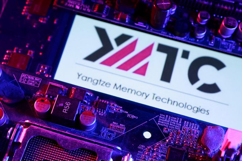 YMTC (Yangtze Memory Technologies) logo and a computer motherboard are seen in this illustration taken April 14, 2026. REUTERS/Dado Ruvic/Illustration