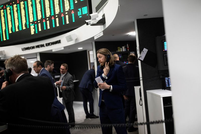 Traders work on the floor of the London Metal Exchange, in London, Britain September 27, 2018. REUTERS/Simon Dawson
