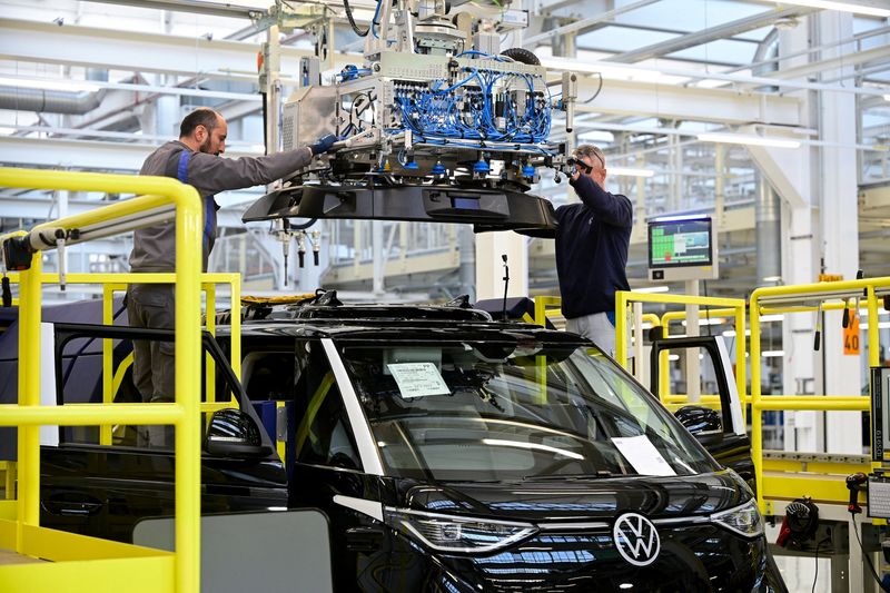 FILE PHOTO: Staff members install a sensor unit on a Volkswagen Id. Buzz AD during a media tour at Volkswagen Commercial Vehicles (Volkswagen Nutzfahrzeuge) in Hanover, Germany, March 4, 2026. REUTERS/Fabian Bimmer/File Photo