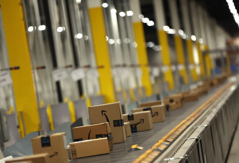 Packages travel on a conveyor at the Amazon's fulfillment center in Robbinsville, New Jersey, U.S., November 27, 2023. REUTERS/Mike Segar