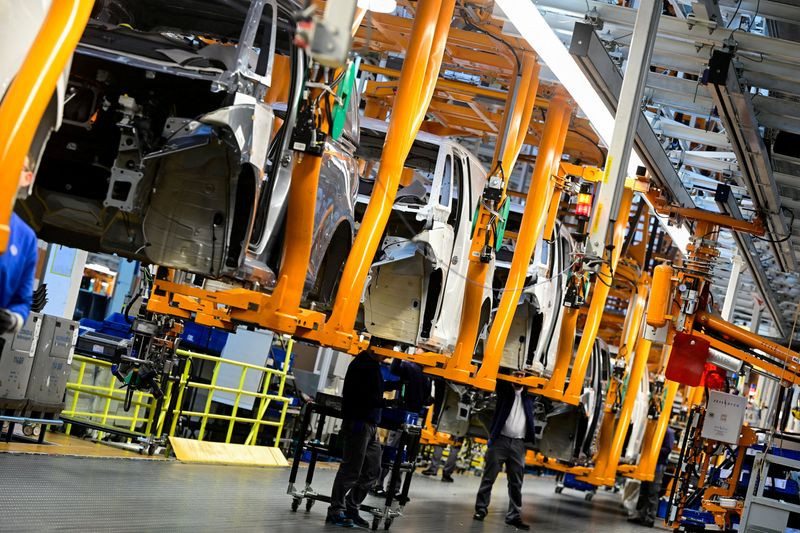 FILE PHOTO: Staff works on Id. Buzz production line during a media tour at Volkswagen Commercial Vehicles (Volkswagen Nutzfahrzeuge) in Hanover, Germany, March 4, 2026. REUTERS/Fabian Bimmer/File Photo
