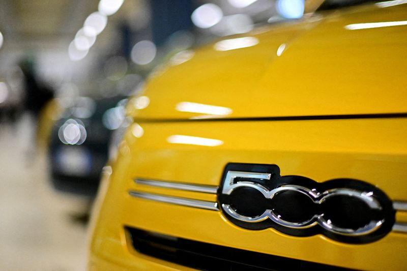 FILE PHOTO: The logo of the new hybrid version of the Fiat 500 on the production line inside the Mirafiori plant in Turin, Italy, November 25, 2025. REUTERS/Daniele Mascolo/File Photo