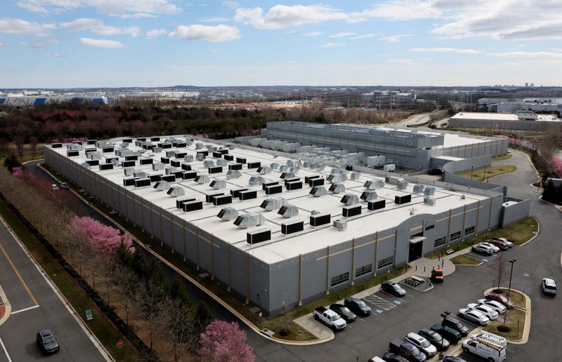 File Photo: A car drives past a building of the Digital Realty Data Center in Ashburn, Virginia, U.S., March 17, 2025. REUTERS/Leah Millis/File Photo