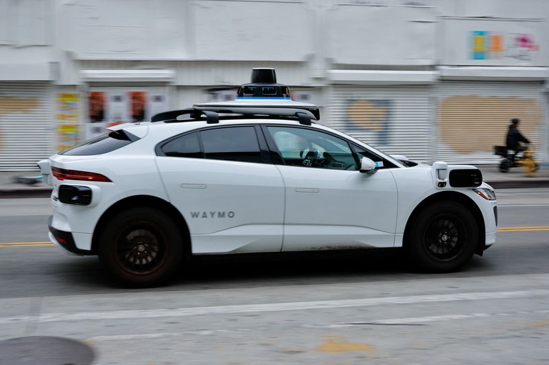 A Waymo driverless car driving in downtown Los Angeles, California, U.S. May 1, 2026.    REUTERS/Mike Blake