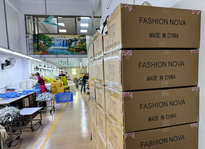 FILE PHOTO: Boxes of clothing for export are pictured at a clothing factory in Guangzhou, Guangdong province, China April 1, 2025. REUTERS/Sophie Yu/File Photo
