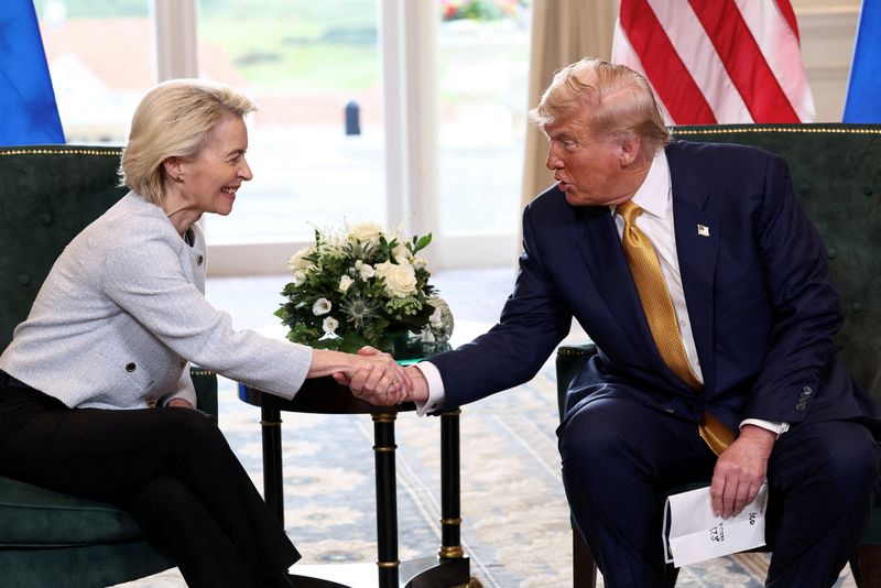 FILE PHOTO: U.S. President Donald Trump shakes hands with European Commission President Ursula von der Leyen, after an announcement of a trade deal between the U.S. and EU, in Turnberry, Scotland, Britain, July 27, 2025. REUTERS/Evelyn Hockstein//File Photo