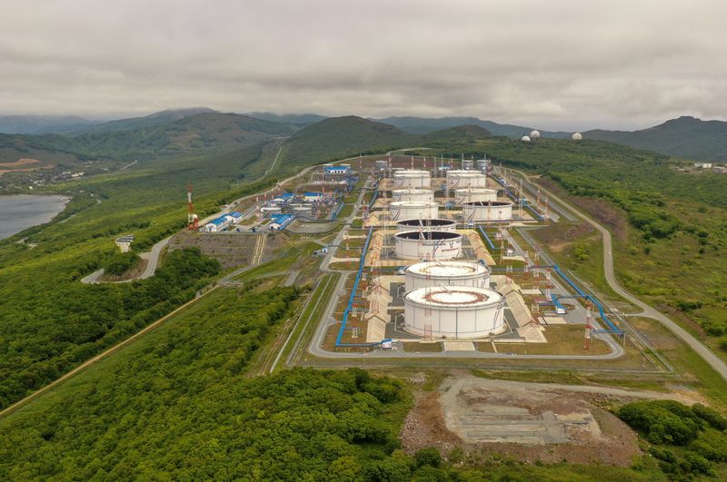 An aerial view shows oil tanks of Transneft oil pipeline operator at the crude oil terminal Kozmino on the shore of Nakhodka Bay near the port city of Nakhodka, Russia June 13, 2022. Picture taken with a drone. REUTERS/Tatiana Meel