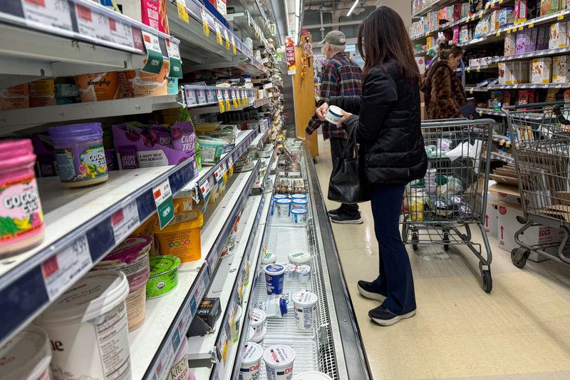 People shop for groceries at a store in Manhasset, New York, U.S., November 19, 2025. REUTERS/Shannon Stapleton