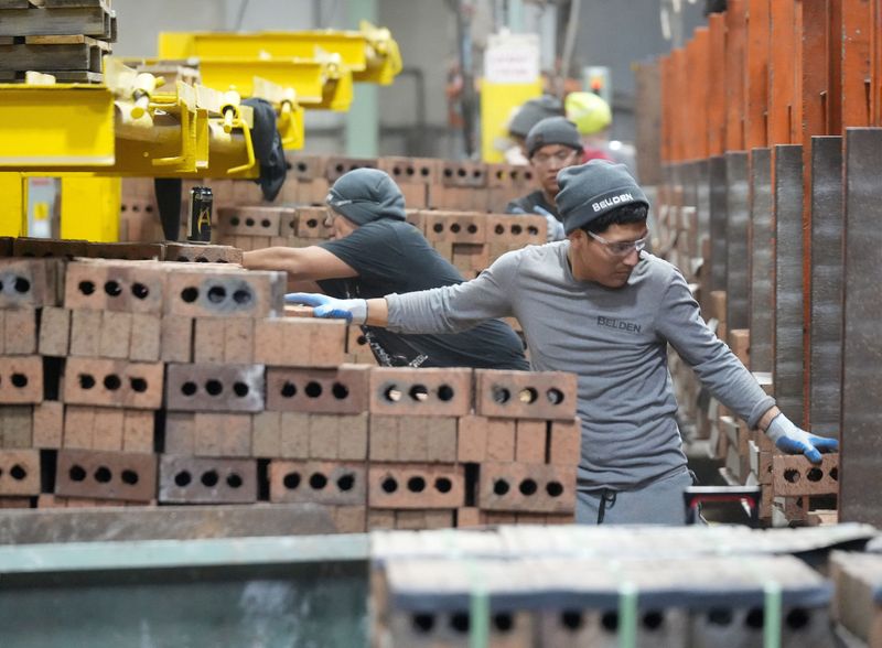 Workers package and cube pallet bricks for shipping at Belden Brick in Sugarcreek, Ohio, U.S., November 12, 2025.  Kevin Whitlock/Massillon Independent/USA TODAY NETWORK via Imagn Images via REUTERS