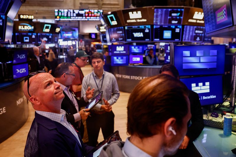 Traders work on the floor of the New York Stock Exchange (NYSE) in New York City, U.S., July 6, 2026. REUTERS/Jeenah Moon