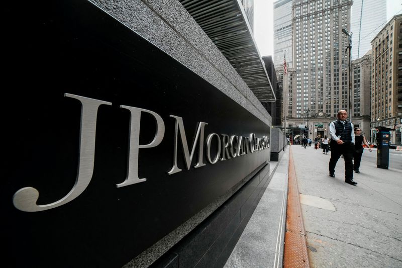 FILE PHOTO: People walk near the JPMorgan Chase & Co., headquarters in New York City, U.S., April 1, 2026. REUTERS/Eduardo Munoz/File Photo
