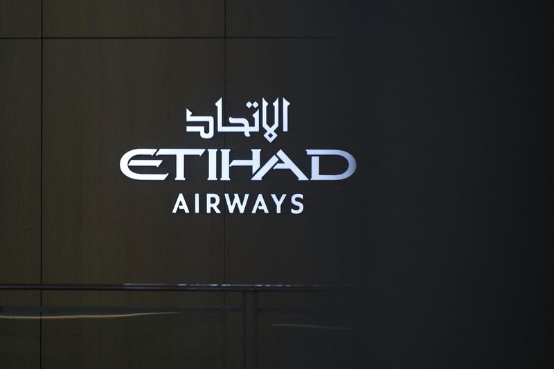 FILE PHOTO: Etihad Airways signage at the Chase Sapphire Lounge inside Terminal 4 at John F. Kennedy (JFK) International Airport in New York City, U.S., March 2, 2026.  REUTERS/Bing Guan/File Photo